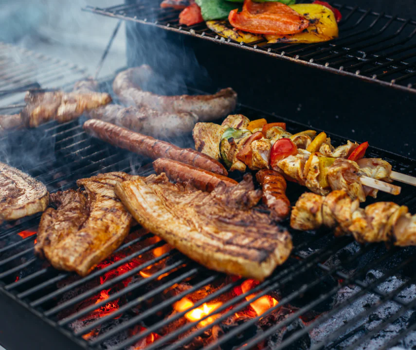 A grill with food BBQing.