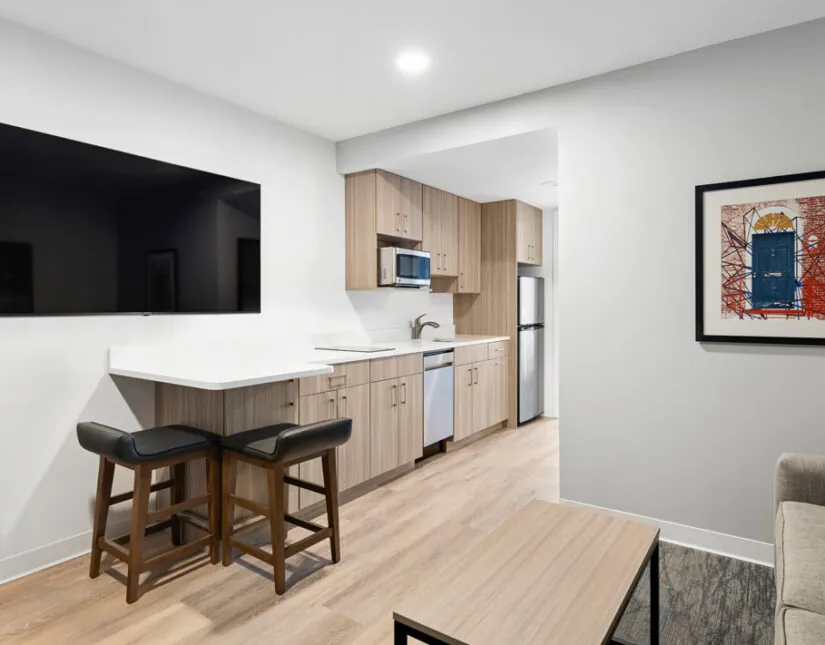 Kitchenette and living room at HomeAwhile in Scarborough.